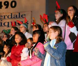 Brownsville Elementary School Choir students sing at Saturday's Christmas tree lighting ceremony in Silverdale.