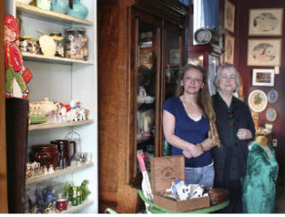 Nanette Nichols (left) and Ruth Reese recently reopened Manette Antiques on East 11th Street in Manette.