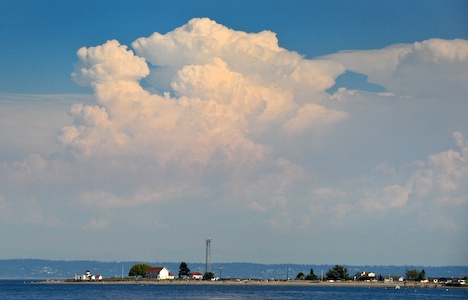 Cumulonimbus clouds formed east of Kitsap County and Point-No-Point as warm tempatures settles into the region.