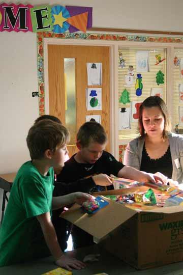 Kaitlin Halady helps students prepare the supplies for shipment to Belize.