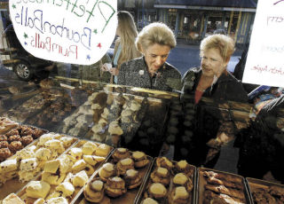 Governor Christine Gregoire (left) and 23rd Legislative District Rep. Sherry Appleton (D— Poulsbo) stop for a little window shopping at Sluys Bakery while stumping in downtown Poulsbo.