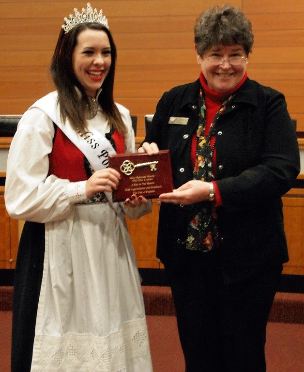 Mayor Becky Erickson presents Makenzie Moody with the key to the city for her work as Miss Poulsbo 2013.