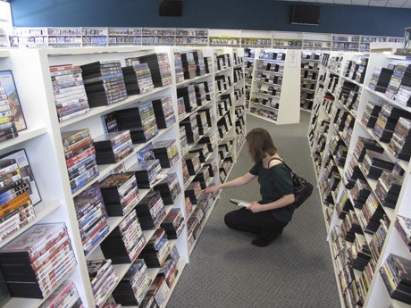 A customer searches for titles at Silver Screen Video on Bainbridge Island.