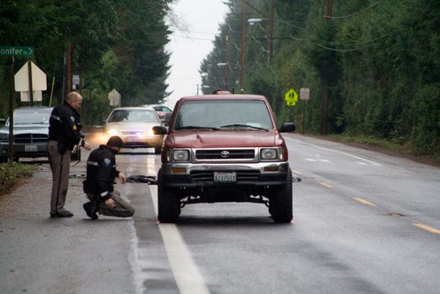 Police investigate the truck involved in the accident  near Fairview Junior High after the accident Wednesday morning.