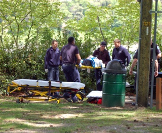 Olympic Ambulance EMTs load a 27-year-old man onto a gurney soon after he jumped off the Warren Avenue Bridge Tuesday afternoon. He didn't appear to sustain any serious injuries.