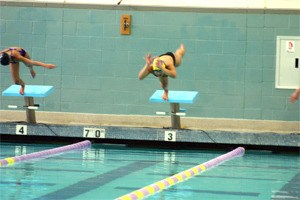 Bethany Aban (Above) dives into the North Kitsap Community Pool during a practice meet on Monday