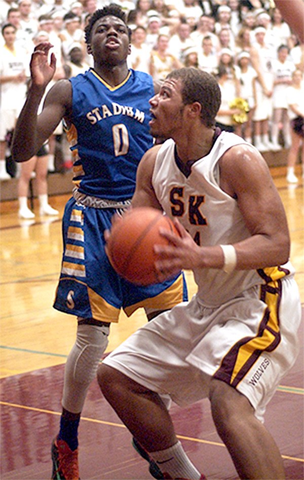 Isaiah Lewis looks to shoot during a game against Stadium last season. Lewis is a senior this year.