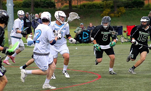 Klahowya’s Avery Schuette (5) and Tanner Weaver (15) close in on North Kitsap’s Keenen Kakuda (with ball) in the Narrows/Olympic Conference lacrosse game April 26 in Poulsbo. Klahowya prevailed 16-12.