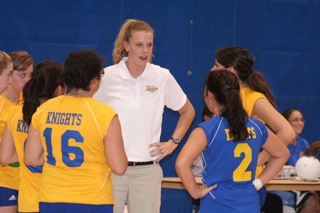 Beth Donnelly huddles with the Bremerton High School volleyball team during a game in 2009. She will take over at Olympic College for the 2010 season.