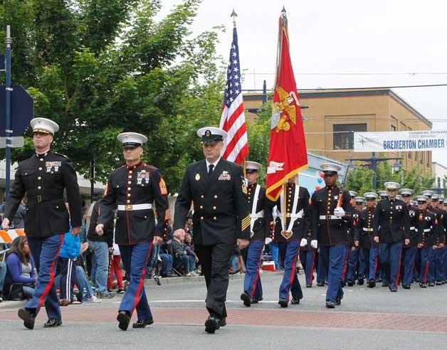 Military members walk down the street in the 2015 Armed Forces Day Parade in Bremerton.