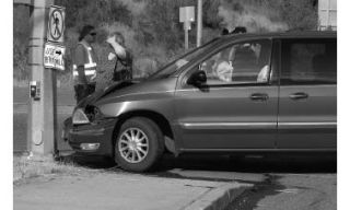 A van was pushed into the post of a traffic light on Loxie Eagans Boulevard June 15 when a blue pickup truck