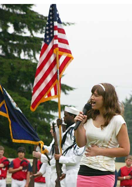 Molly Walmsley sings the national anthem during the opening ceremony of the 2010 Babe Ruth 13-year-old state tournament