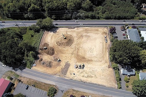 An aerial photo of property owned by St. Vincent de Paul between Bethel Avenue and Mitchell Road shows progress being made to clear it for construction of a new building for the not-for-profit agency. The building