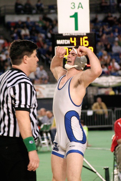 Olympic High School sophomore Caleb O'Halek celebrates after winning a state wrestling title Feb. 20 at Mat Classic XXI at the Tacoma Dome.