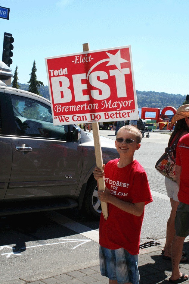 A young supporter of Todd Best waved a campaign sign Saturday during a rally for mayoral candidate Tom Best. The rally garnered about 50 people.