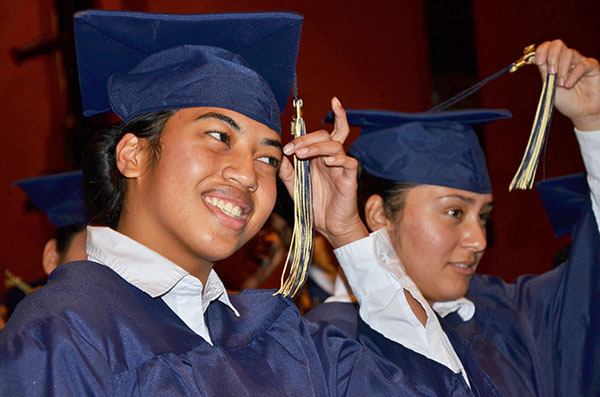 Students at the Washington Youth Academy celebrate their graduation with the tradition of moving tassels on their caps. The school helps at-risk youth earn their high school diploma.