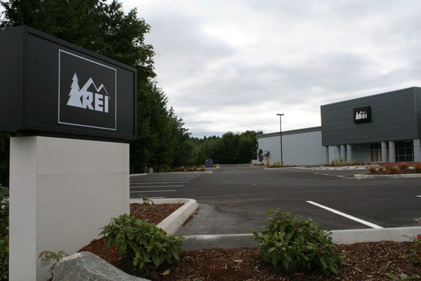 Signage is up at the new Silverdale REI store which plans to open this fall.