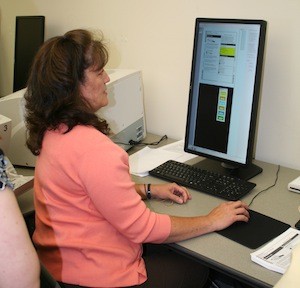 Election Analyist Tina Agnew demonstrates the voting system install at the Kitsap County Auditor's Office.