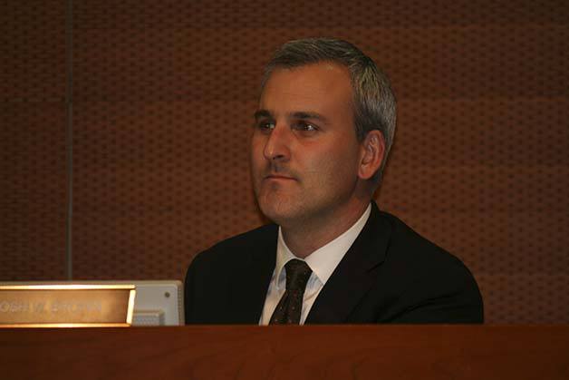 Kitsap County Comissioner Josh Brown listens to a presentation on the 2014 county budget at this week’s county commission meeting. He is leaving the commission on Dec. 31.