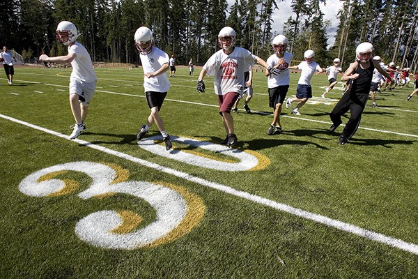 The Kingston Buccaneers football team practices on Buccaneer Field in 2007. The field and surrounding area are only permitted for practices