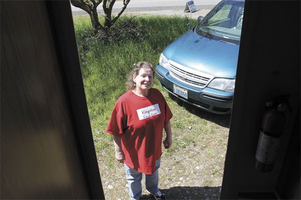 Barb Fulton stands outside the doorway of her motor home
