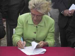 Gov. Chris Gregoire signs paperwork designating $5 million for the Wine Science Center during a ceremony in October near the Washington State University Tri-Cities campus in Richland.