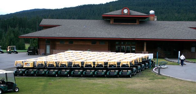 Empty golf carts are lined up at Gold Mountain Golf Course.