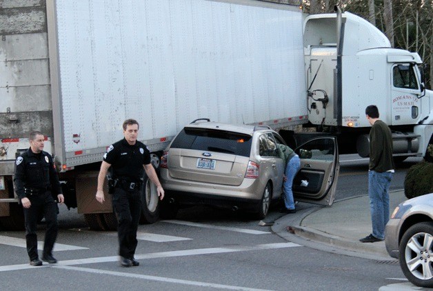 A car collided with a semi-truck Monday afternoon at Sunset Street and Front Street.