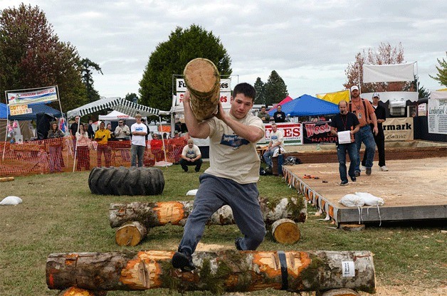 Nate Iott runs through a lumberjack obstacle course at the 2012 Old Mill Days in Port Gamble.