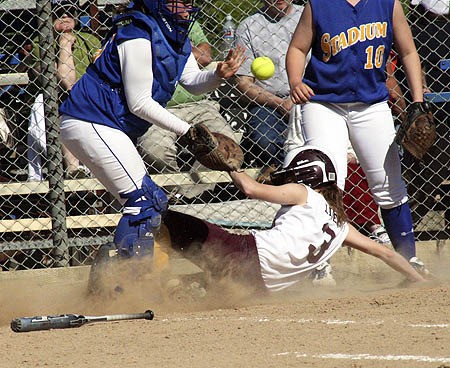 South Kitsap’s Molly Lider slides home ahead of the throw in the fifth inning of the Wolves’ win over Stadium.