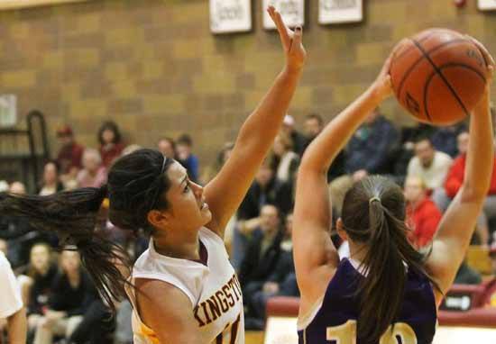 Kingston's Savannah Turrieta works to block a pass by North Kitsap Jan. 13. Both Kingston basketball teams went on to defeat North Kitsap.