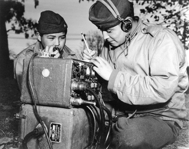 Navajo cousins Private First Class Preston Toledo (left) and Private First Class Frank Toledo served in a Marine Artillery Regiment in the South Pacific during WWII. Both were code talkers. This photo was taken on July 7