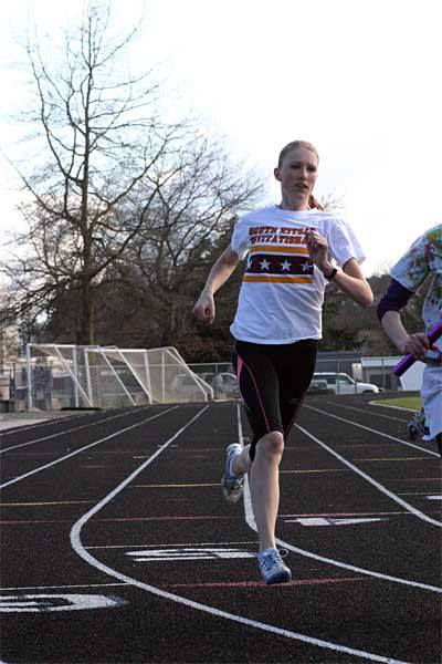 West Sound Academy sophomore Reagan Colyer shuffles between two schools in order to compete in the 100 meter and 300 meter hurdle events for North Kitsap.