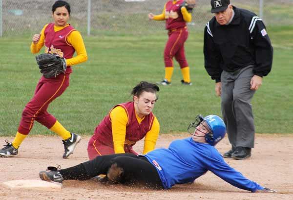 Kingston's Alexa Ekonomakis tags out a North Mason runner at second during a home game March 21. The Buccaneers fastpitch team won 11-1.