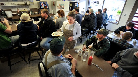 Junction Diner owner Sherri Yackulic chats with regular customers Joe Emel