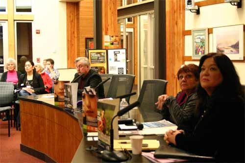 Shawna Seals and Detective Harry James watch a video about human trafficking