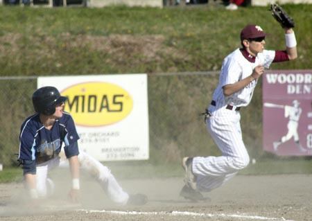 South Kitsap third baseman Zach Mendiola tagged out Gig Harbor's Carl Beck