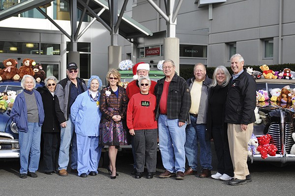 Olympic Vintage Auto Club members recently delivered teddy bears to Harrison Medical Center in Silverdale. The teddy bears are given to children who are brought to the emergency room in crisis.