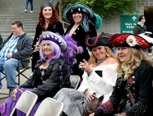 Crew members of Pyrates of the Coast listen to their fellow pirates perform at the Kitsap Harbor Festival May 28. The musical band