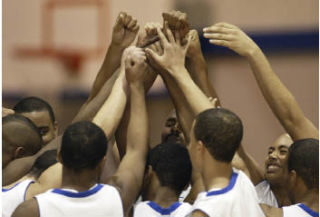 The Bremerton boys basketball team huddles during a 2008 game against North Mason. The Bremerton School District (BSD) is the only one in Kitsap County that doesn’t assess participation fees beyond the $35 Associated Student Body card athletes are required to purchase.