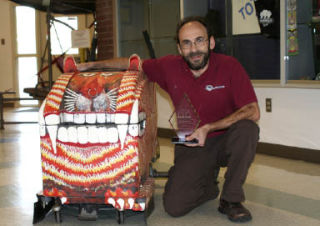 Brownsville Elementary School custodian Pat Nicholson with his floor scrubber “Fang.”