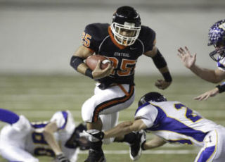 CK running back H’arion Gaulden fights off an Issaquah defender at the Class 4A state semifinals at the Tacoma Dome in 2008.