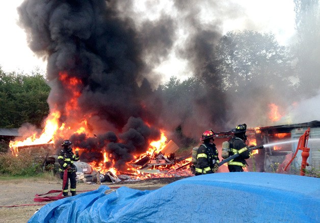 Fire crews tackle a blaze at a garage on Genes Lane in Poulsbo on the morning of July 14