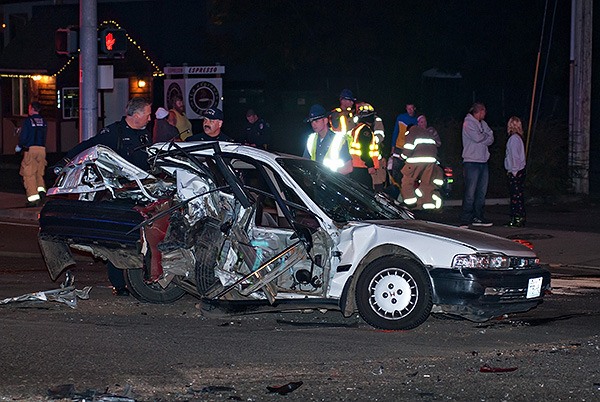 Police and firefighters work at the scene of a multiple vehicle crash at the intersection of Kitsap Way and National Avenue around 9:30 p.m. Nov. 6