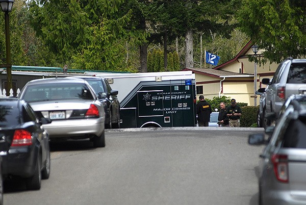 Kitsap County Sheriff's Deputies work at the Kariotis Mobile Home Park on March 28.