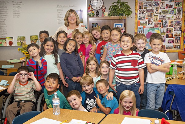 Kim Witte and her current students gather in their classroom for a photo. Witte was named Teacher of the Year at the regional and district level.