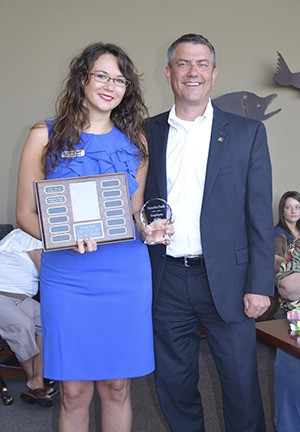 Natashia Dault is presented her awards by Anthony George.