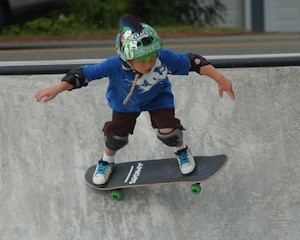 Jackson Merek skates inside the bowl at the new South Kitsap Skate Park on Friday morning. The Lynnwood boy was one of more than a dozen people who were at the park after the construction fences were removed.