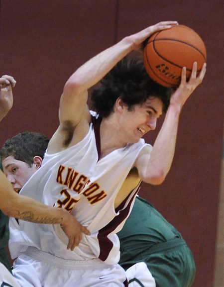 Kingston High's Zane Ravenholt battles through double coverage against Port Angeles earlier this season.