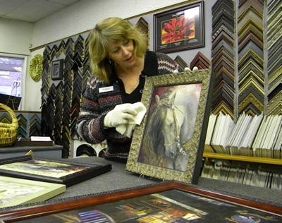 Downtown merchant Mallory Jackson prepares for Friday’s Art Walk.